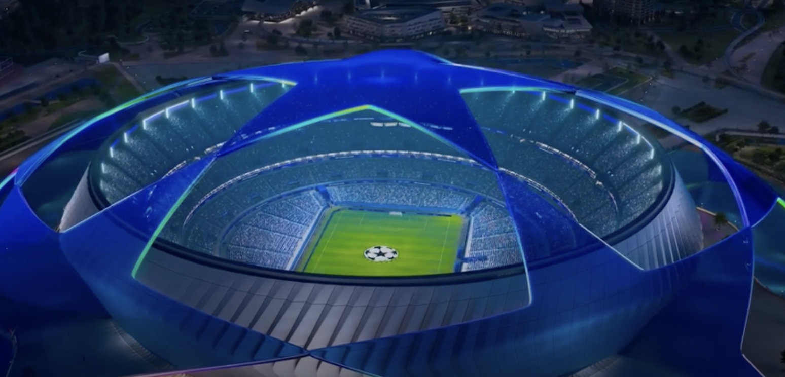 A photo of a major European stadium lit up during a Champions League night match.